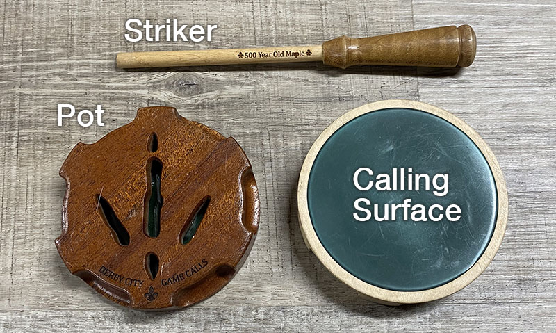 Photo of two friction turkey calls with the main parts labeled.