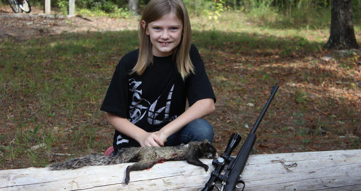 The author's daughter Brooke with her first Georgia fox squirrel.