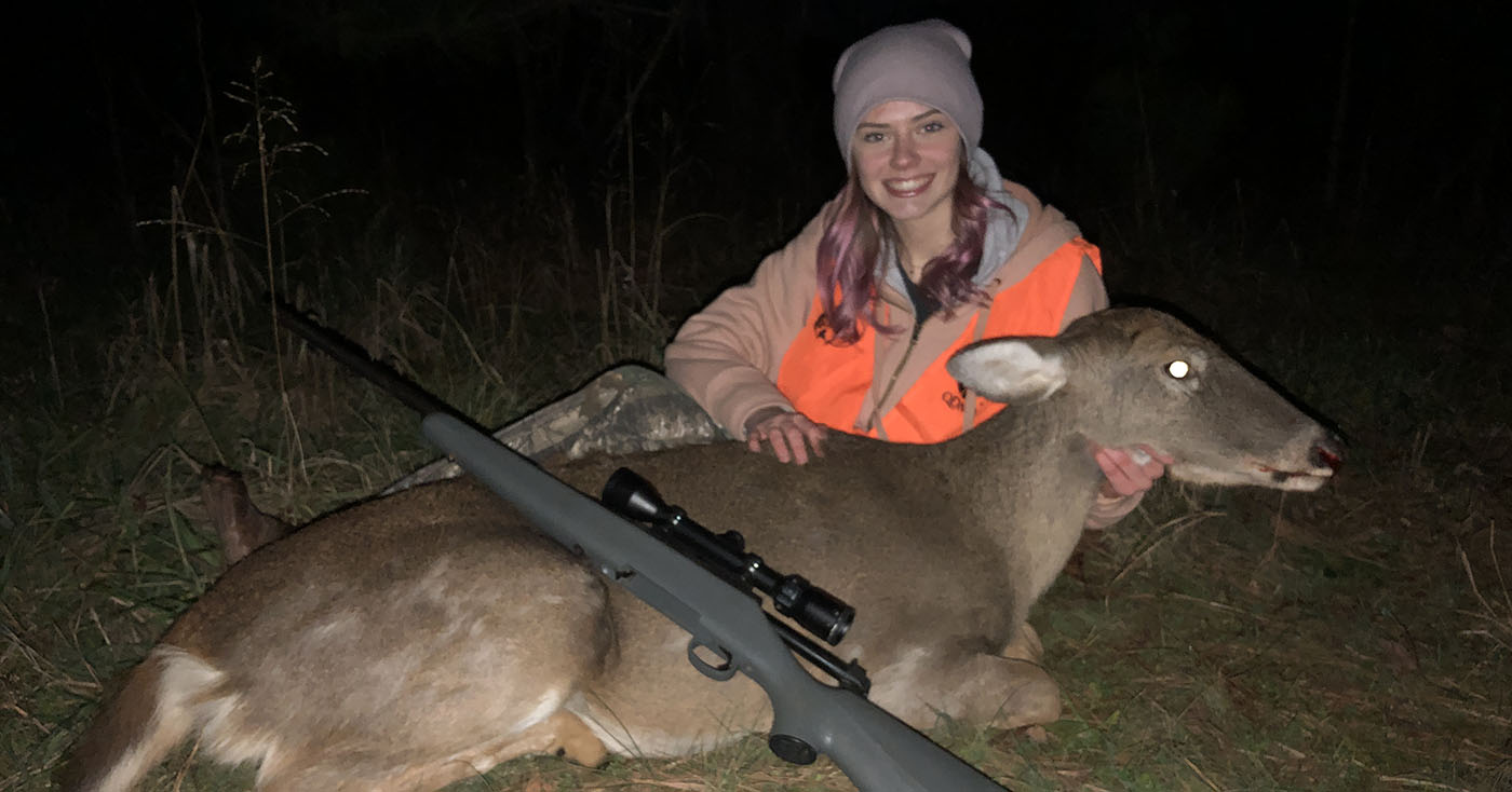 The author's daughter with a big doe taken during deer season.